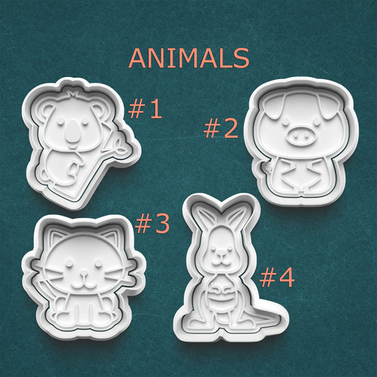 Four animal-shaped cookie cutters on a teal background with labels.