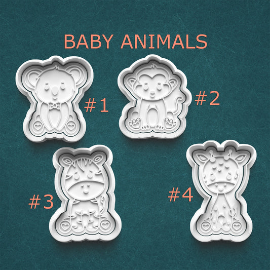 Four baby animal-shaped cookie cutters on a teal background with 'BABY ANIMALS' text above.