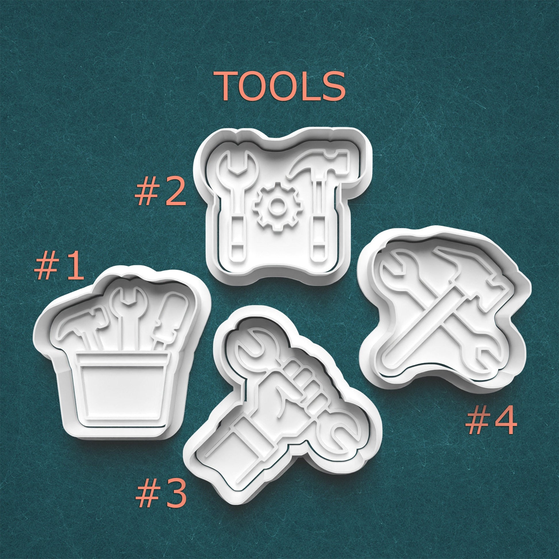 Four cookie cutters with tool designs on a teal background