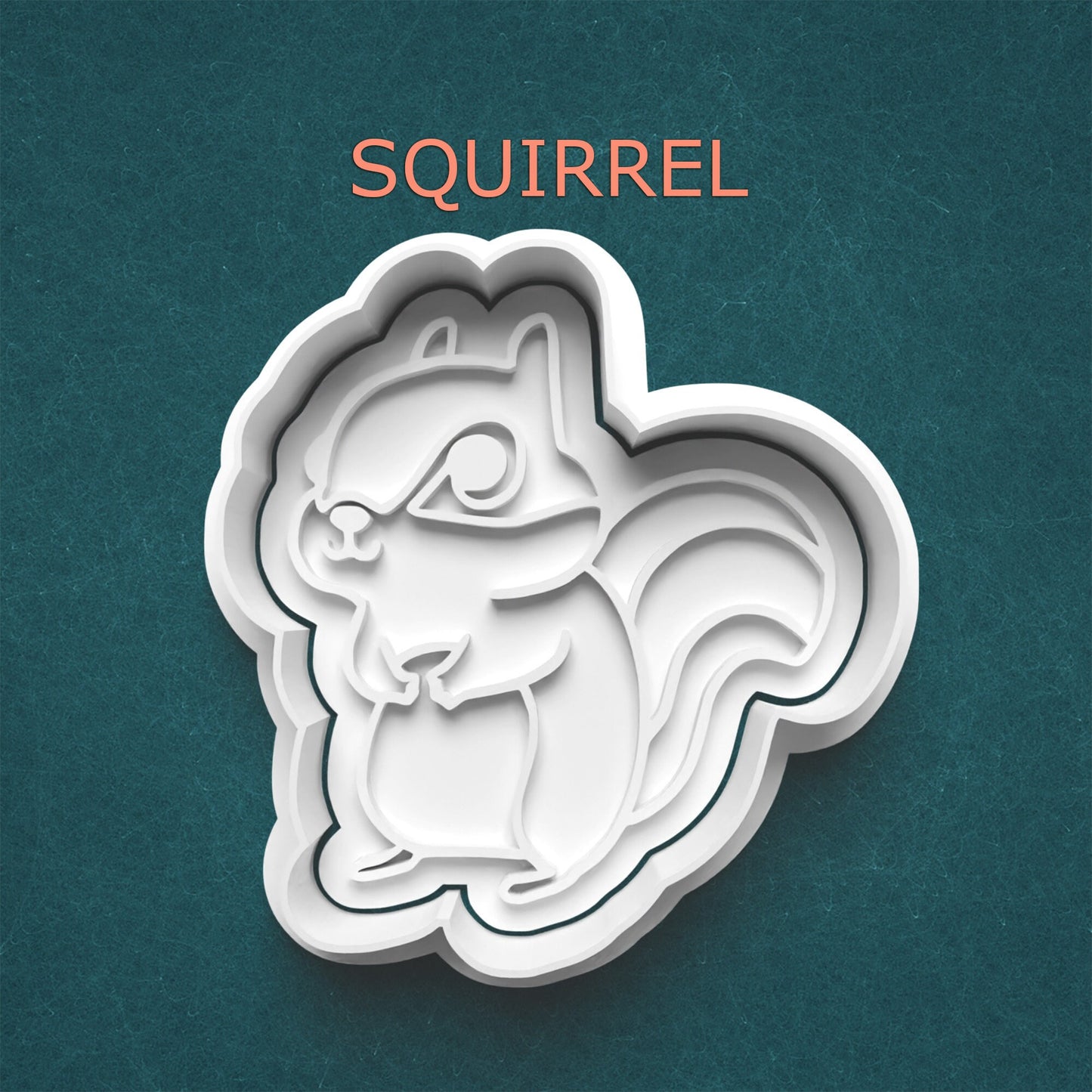 Squirrel-shaped cookie cutter on a teal background with 'SQUIRREL' text above.